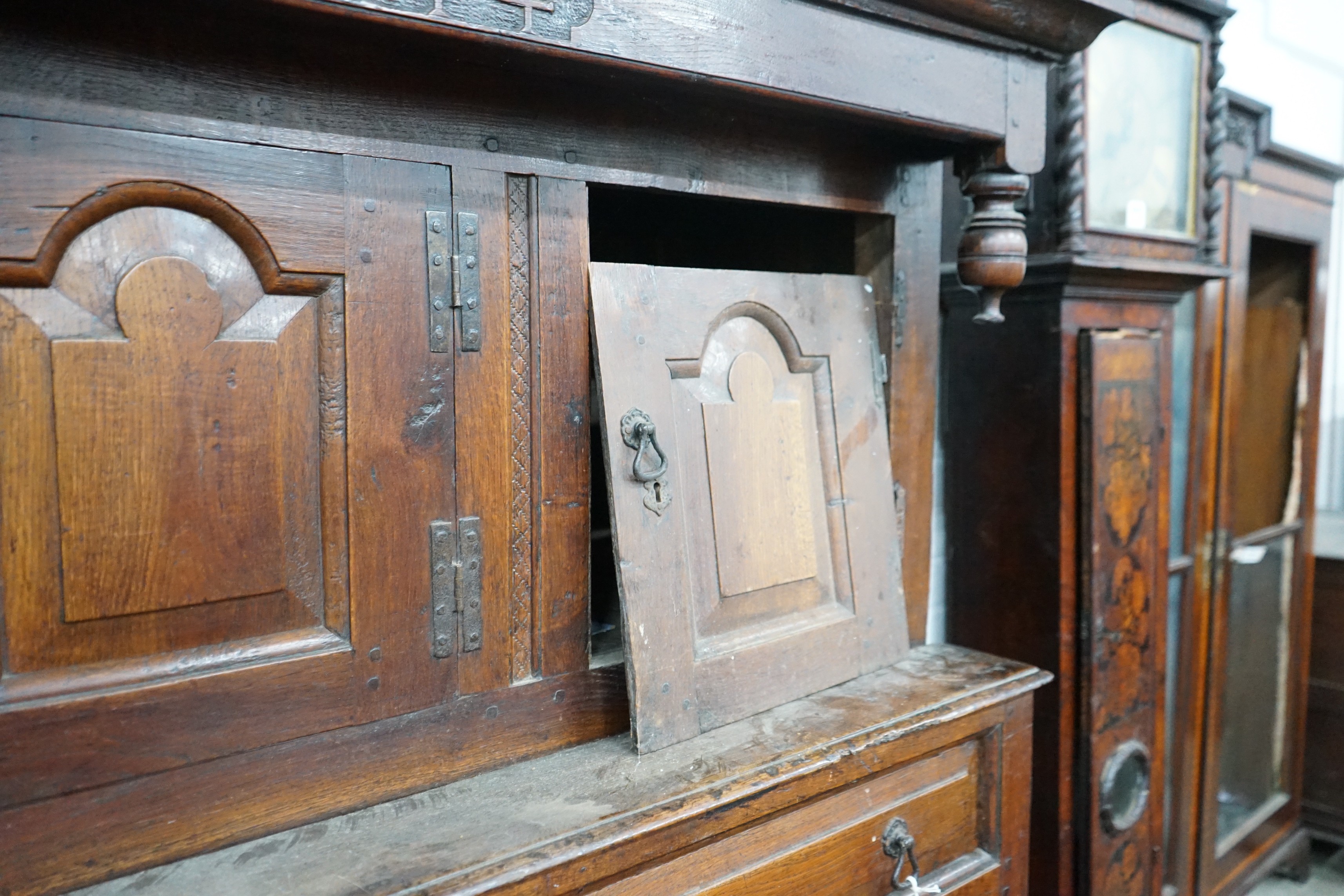 A mid 18th century oak court cupboard, initialled MR and dated 1744, width 155cm, depth 57cm, height 181cm